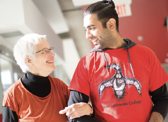 Student in conversation with older adult