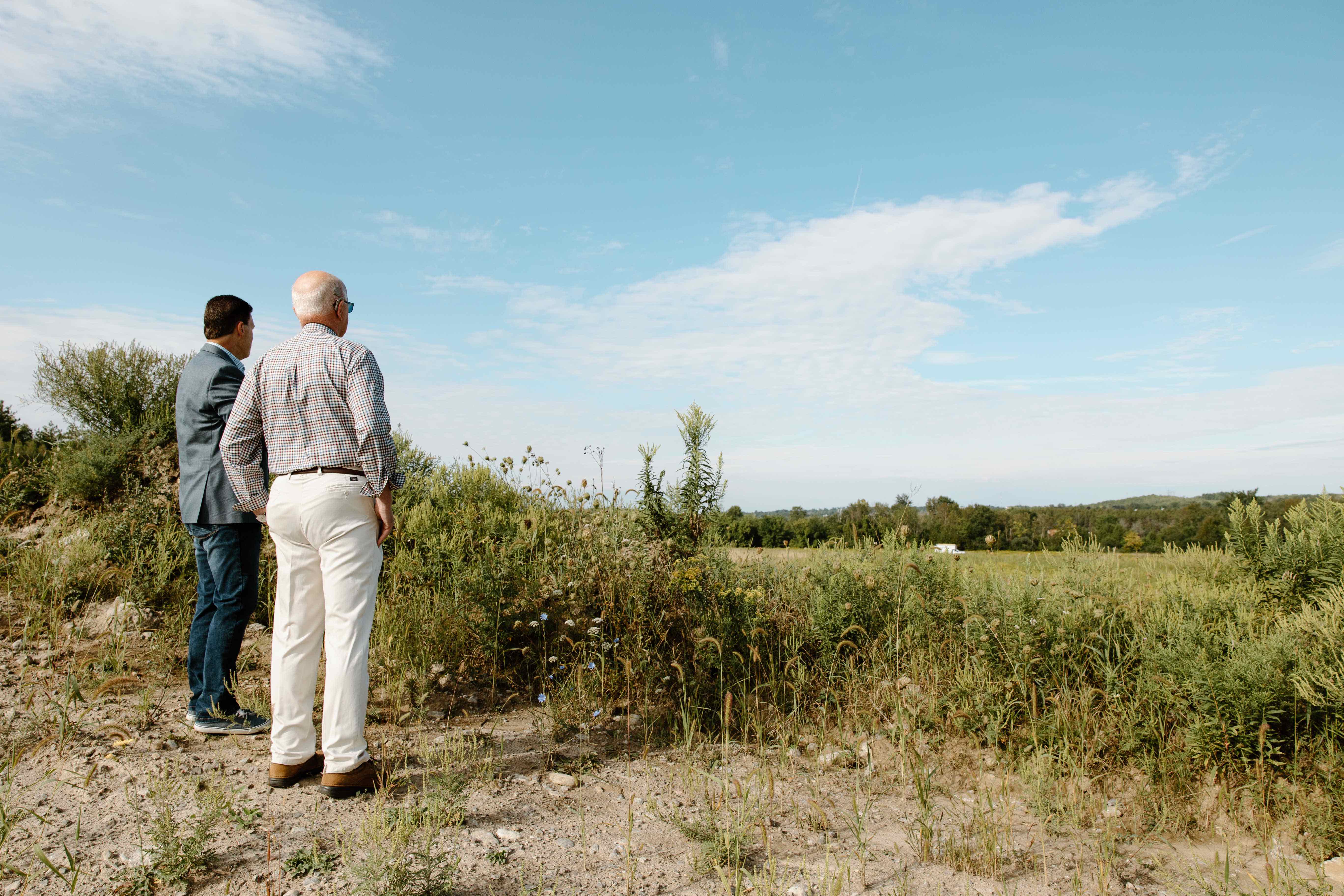 Two men looking at a new building site